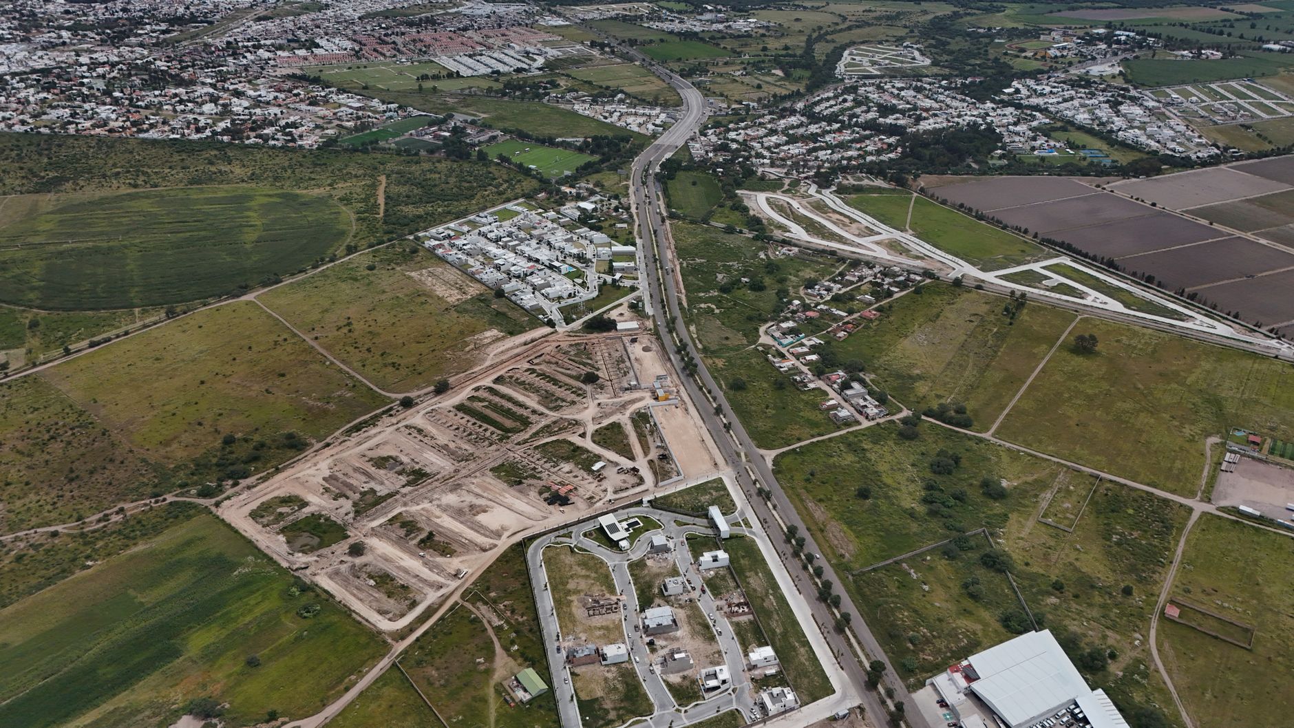 Aerial view of a plotted land development, representative of Dholera plots